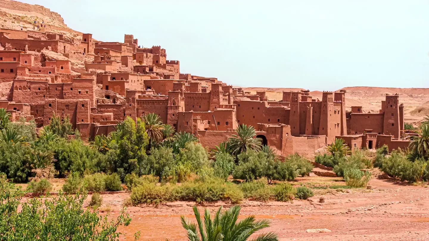 The ksar of Aït Ben Haddou above its palm grove and the dry river bed